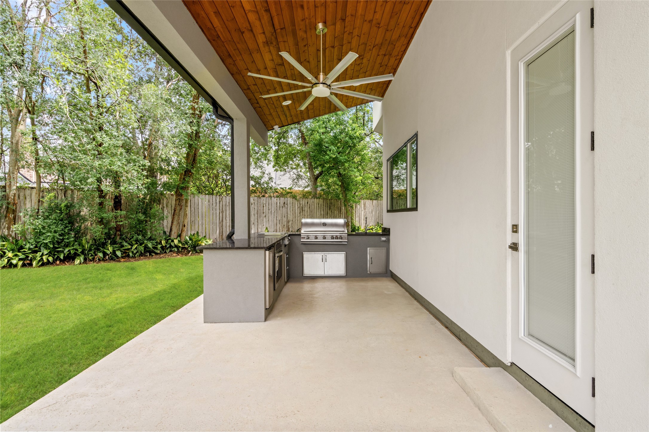 625 Piney Point Road Houston, TX 77024 - Photo 29 of 42 a view of a patio with a backyard