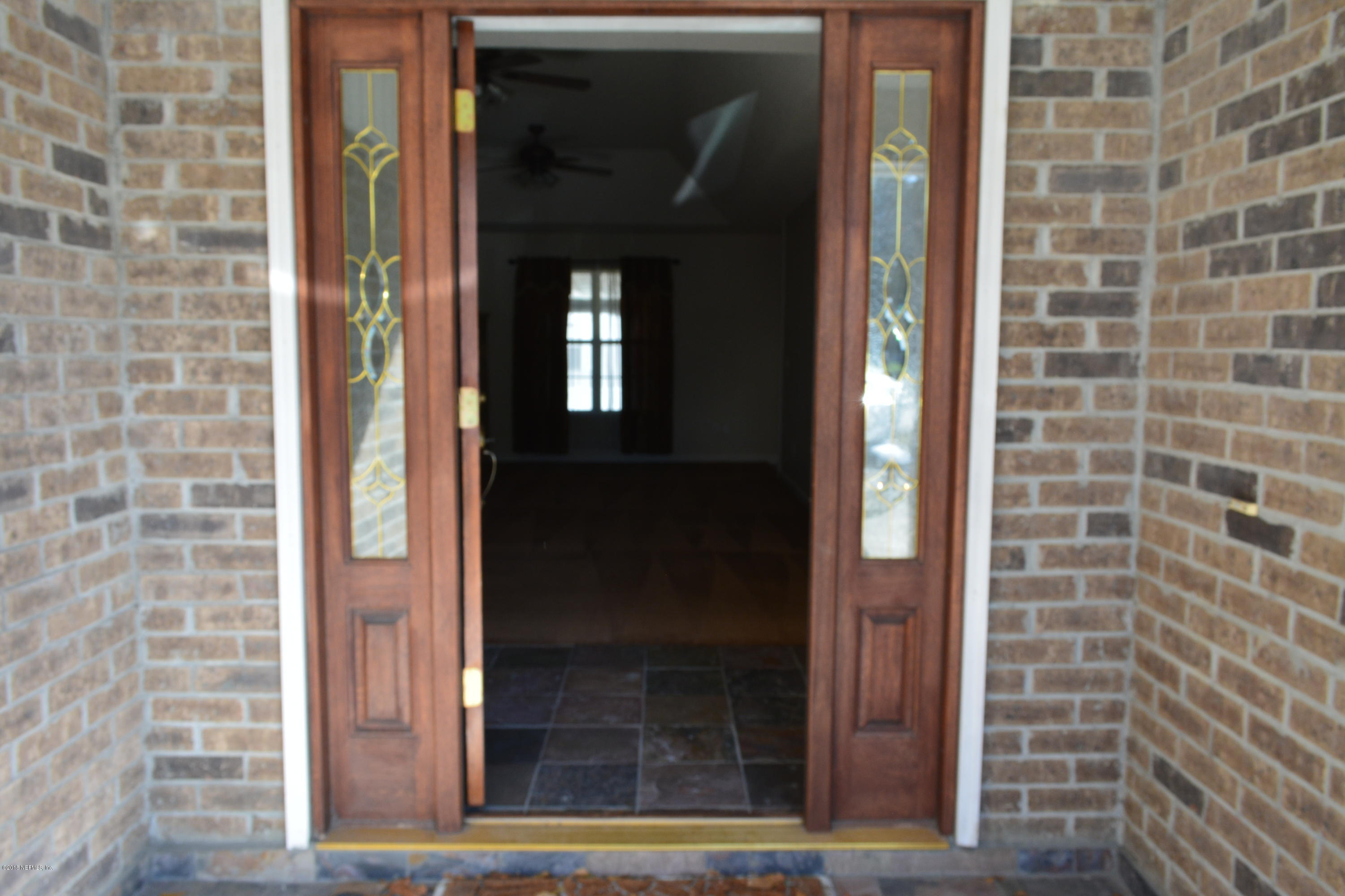 9161 Hipps Road Jacksonville, FL 32222 - Photo 3 of 16 Front Wood Door