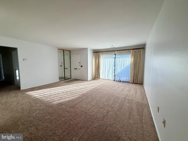 a view of an empty room and window