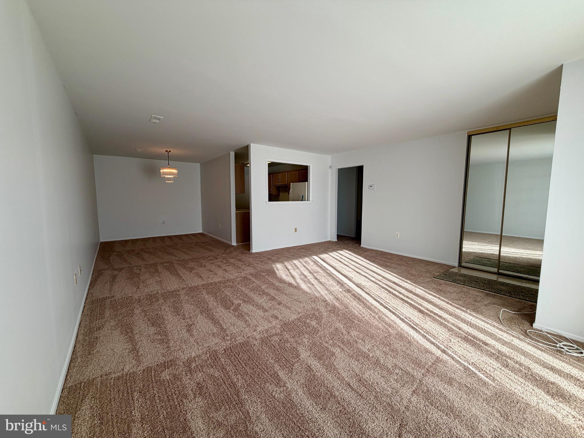 3103 Beckenham Court, Unit 252D Silver Spring, MD 20906 - Photo 3 of 13 a view of a livingroom with a bedroom