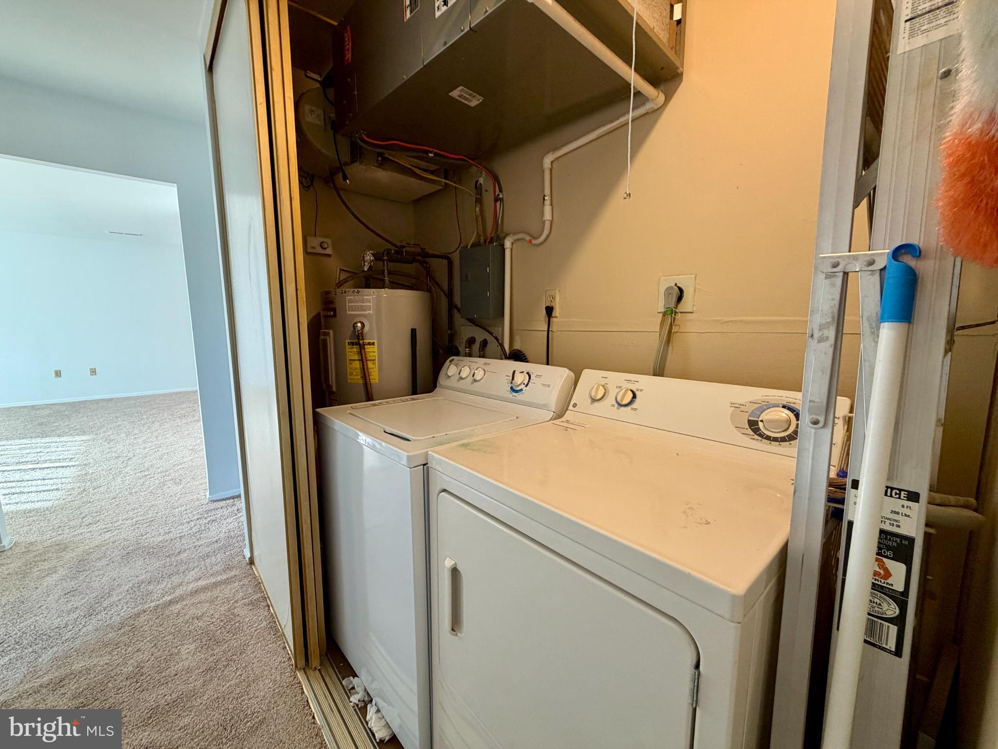 3103 Beckenham Court, Unit 252D Silver Spring, MD 20906 - Photo 8 of 13 a utility room with dryer and washer