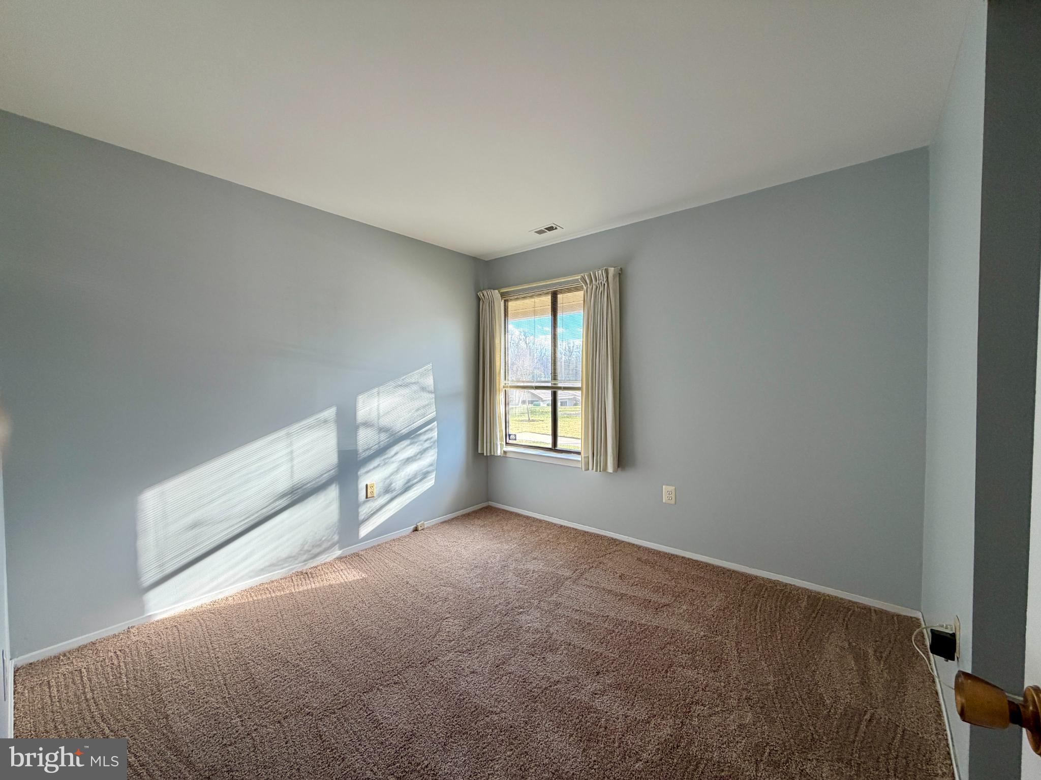 3103 Beckenham Court, Unit 252D Silver Spring, MD 20906 - Photo 9 of 13 a view of an empty room with a window