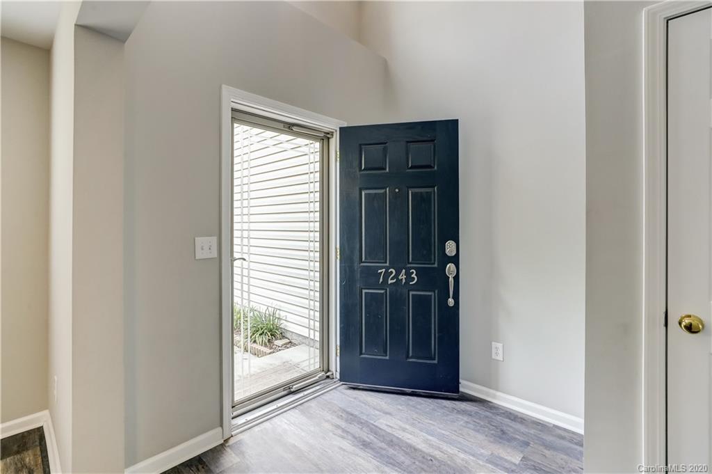 7243 Cascading Pines Drive Tega Cay, SC 29708 - Photo 2 of 33 an empty room with window and wooden floor