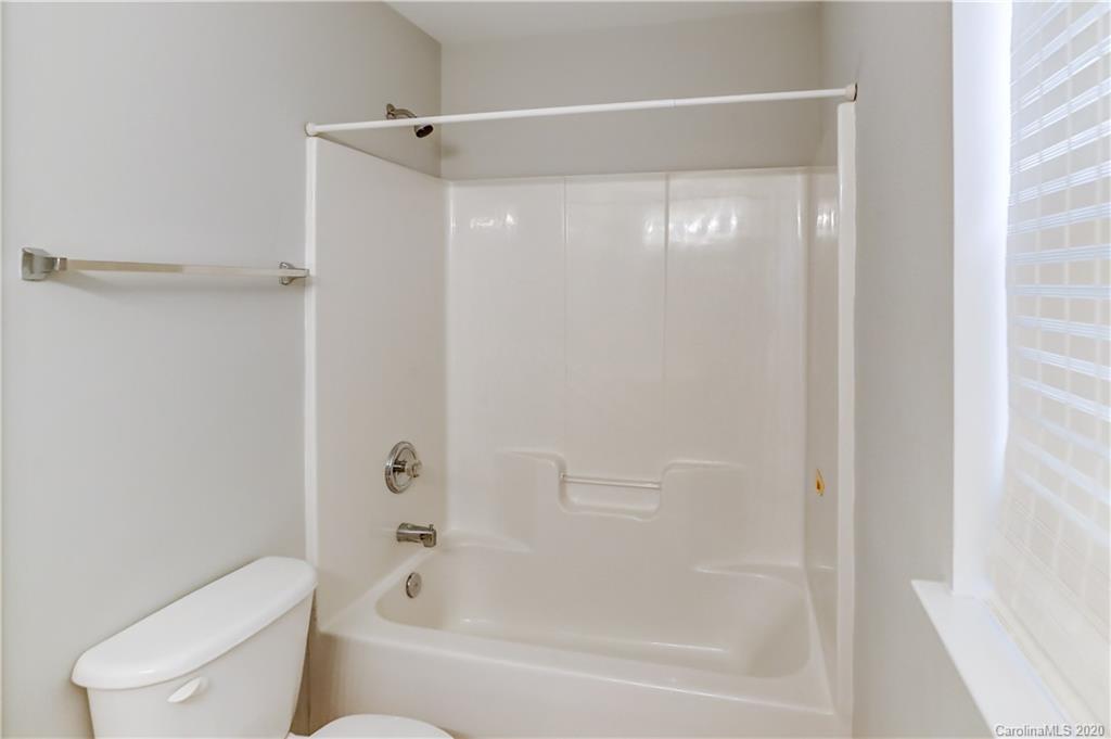 7243 Cascading Pines Drive Tega Cay, SC 29708 - Photo 17 of 33 a bathroom with a bathtub and a shower
