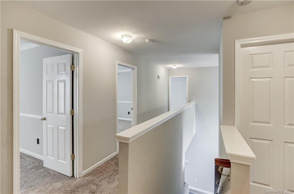 7243 Cascading Pines Drive Tega Cay, SC 29708 - Photo 18 of 33 a view of a hallway with windows and entryway