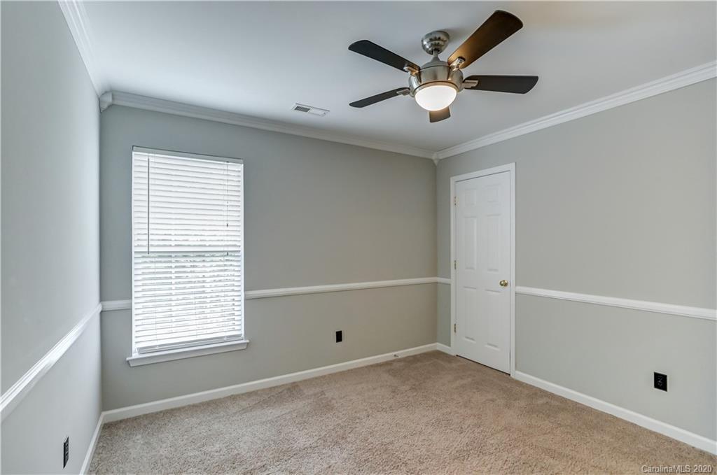 7243 Cascading Pines Drive Tega Cay, SC 29708 - Photo 19 of 33 a view of an empty room with a window