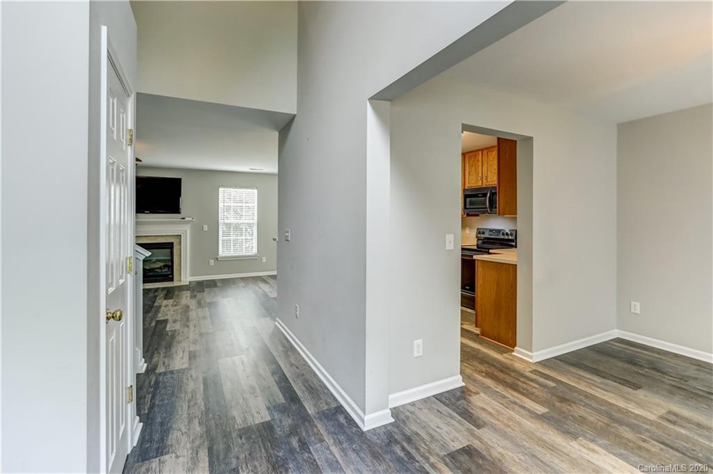 7243 Cascading Pines Drive Tega Cay, SC 29708 - Photo 3 of 33 a view of hallway with wooden floor