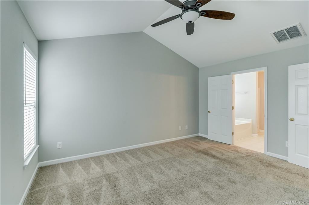 7243 Cascading Pines Drive Tega Cay, SC 29708 - Photo 22 of 33 a view of an empty room and window
