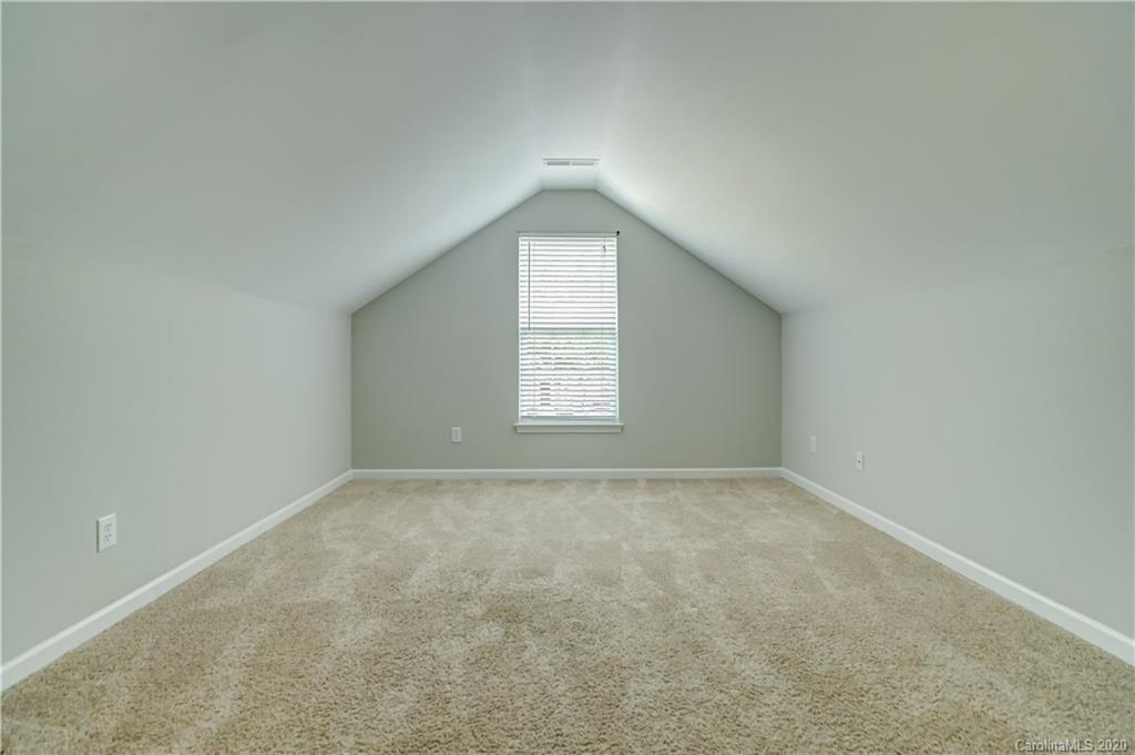 7243 Cascading Pines Drive Tega Cay, SC 29708 - Photo 27 of 33 an empty room with a window