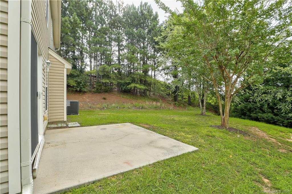 7243 Cascading Pines Drive Tega Cay, SC 29708 - Photo 30 of 33 a view of a park with large trees