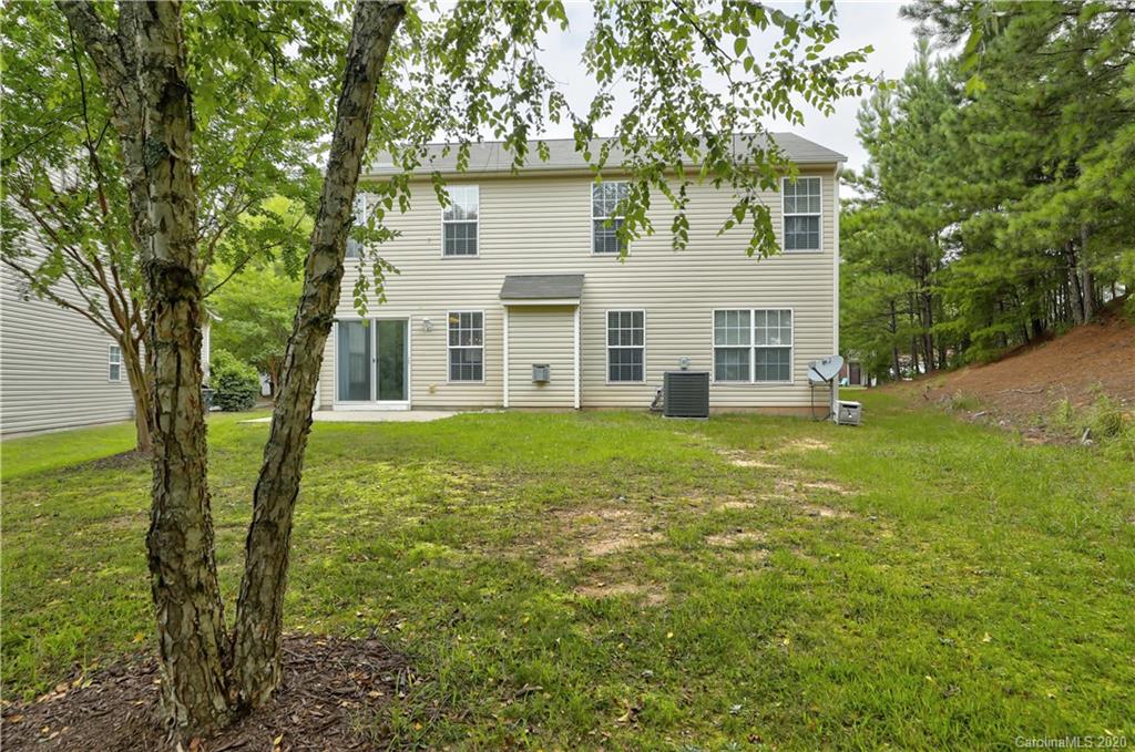 7243 Cascading Pines Drive Tega Cay, SC 29708 - Photo 33 of 33 a view of a house with a yard
