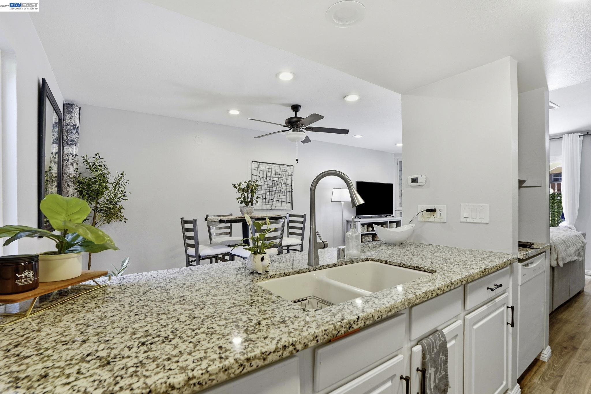 5505 Roundtree Drive, Unit B Concord, CA 94521 - Photo 11 of 29 a bathroom with a granite countertop sink and a mirror