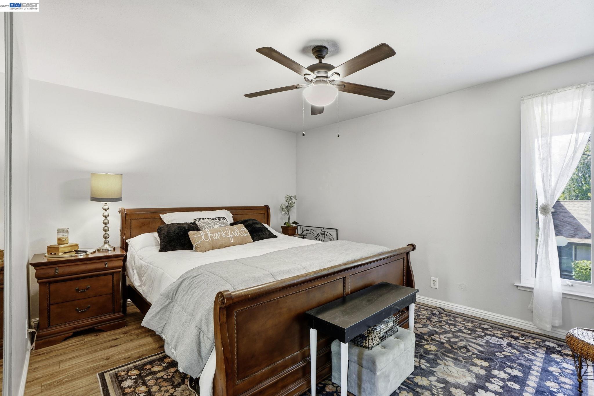 5505 Roundtree Drive, Unit B Concord, CA 94521 - Photo 15 of 29 a bedroom with a bed and a window