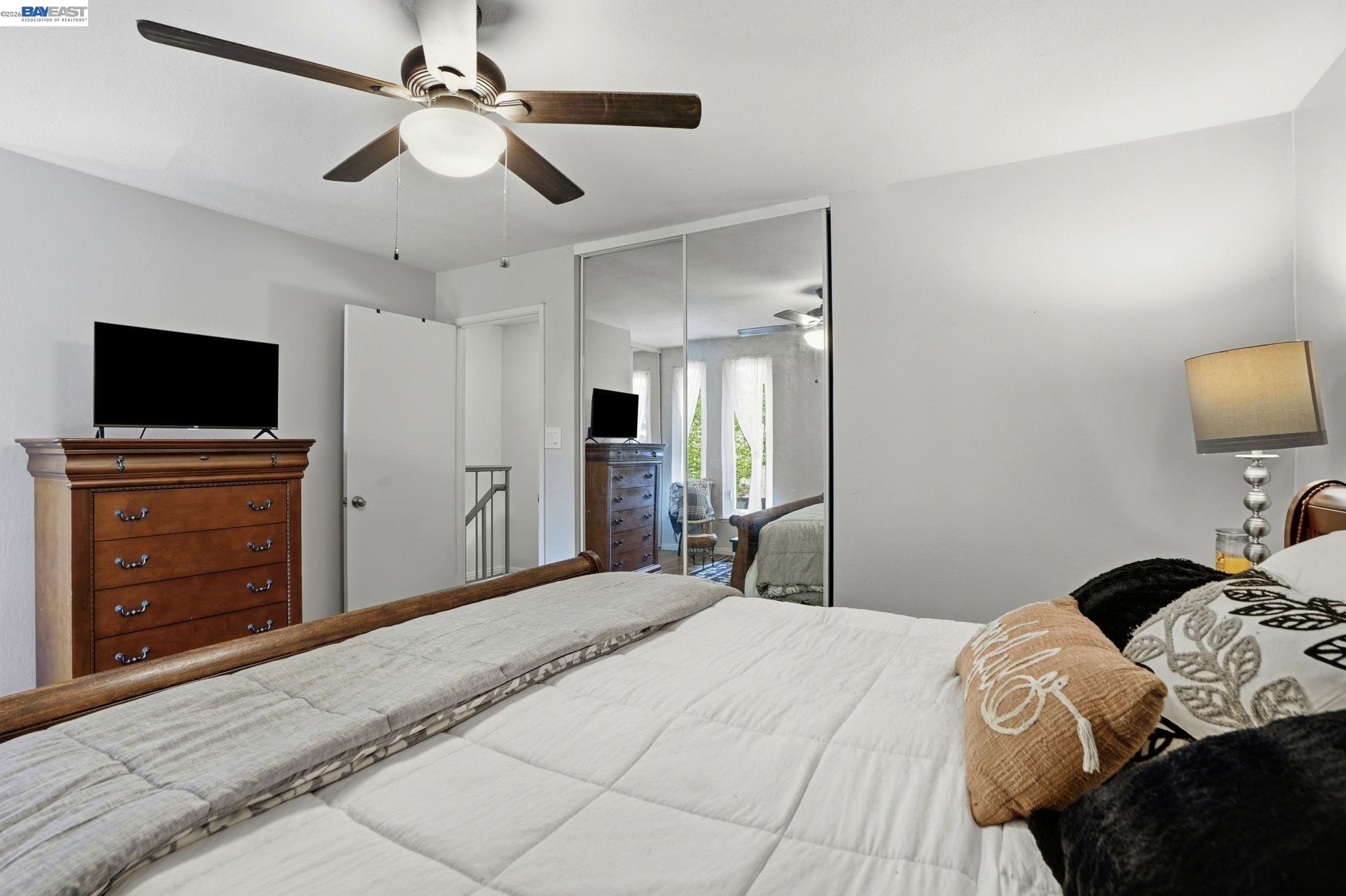 5505 Roundtree Drive, Unit B Concord, CA 94521 - Photo 17 of 29 a bedroom with a bed and a flat screen tv