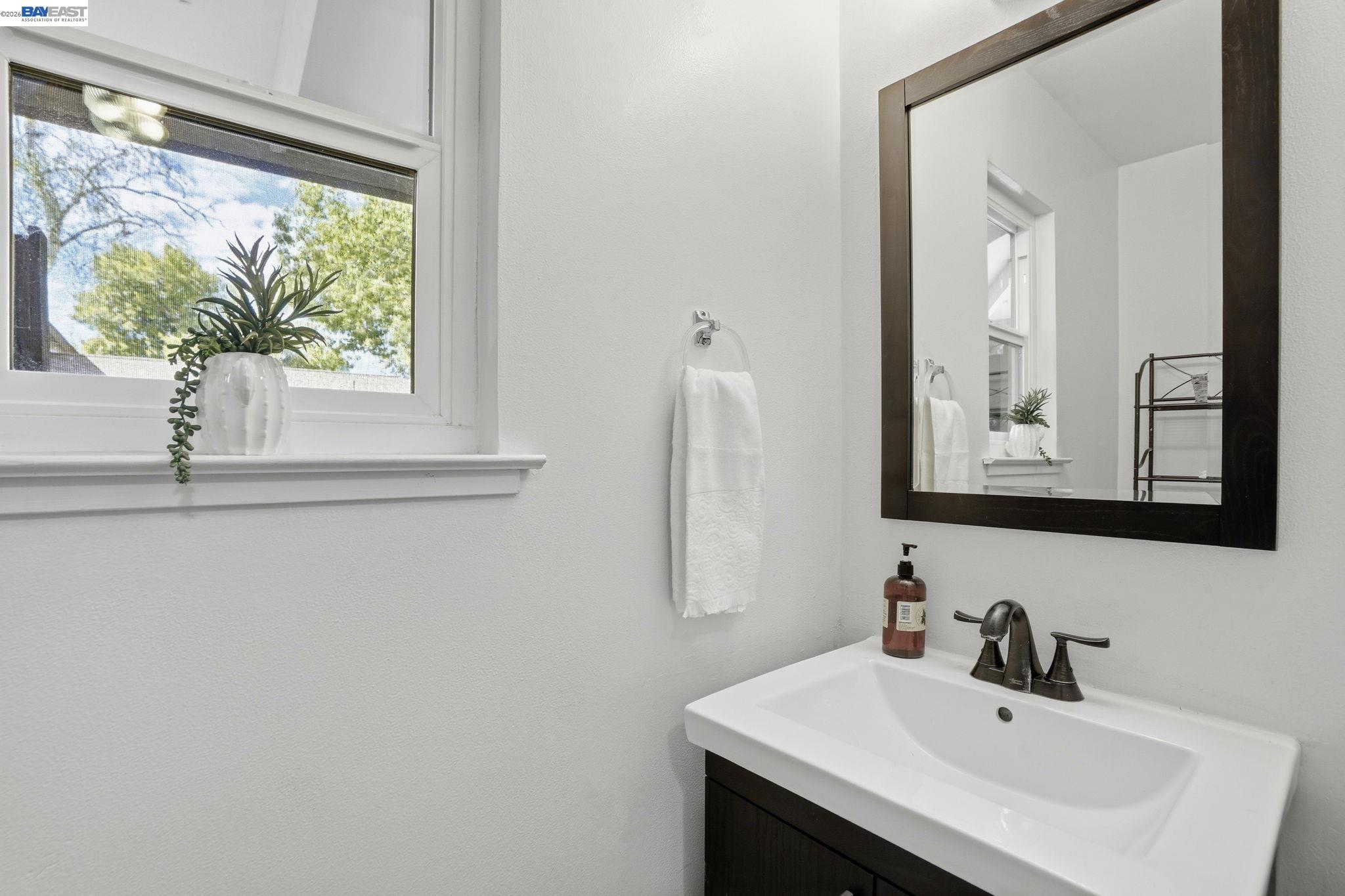 5505 Roundtree Drive, Unit B Concord, CA 94521 - Photo 18 of 29 a bathroom with a sink and a mirror