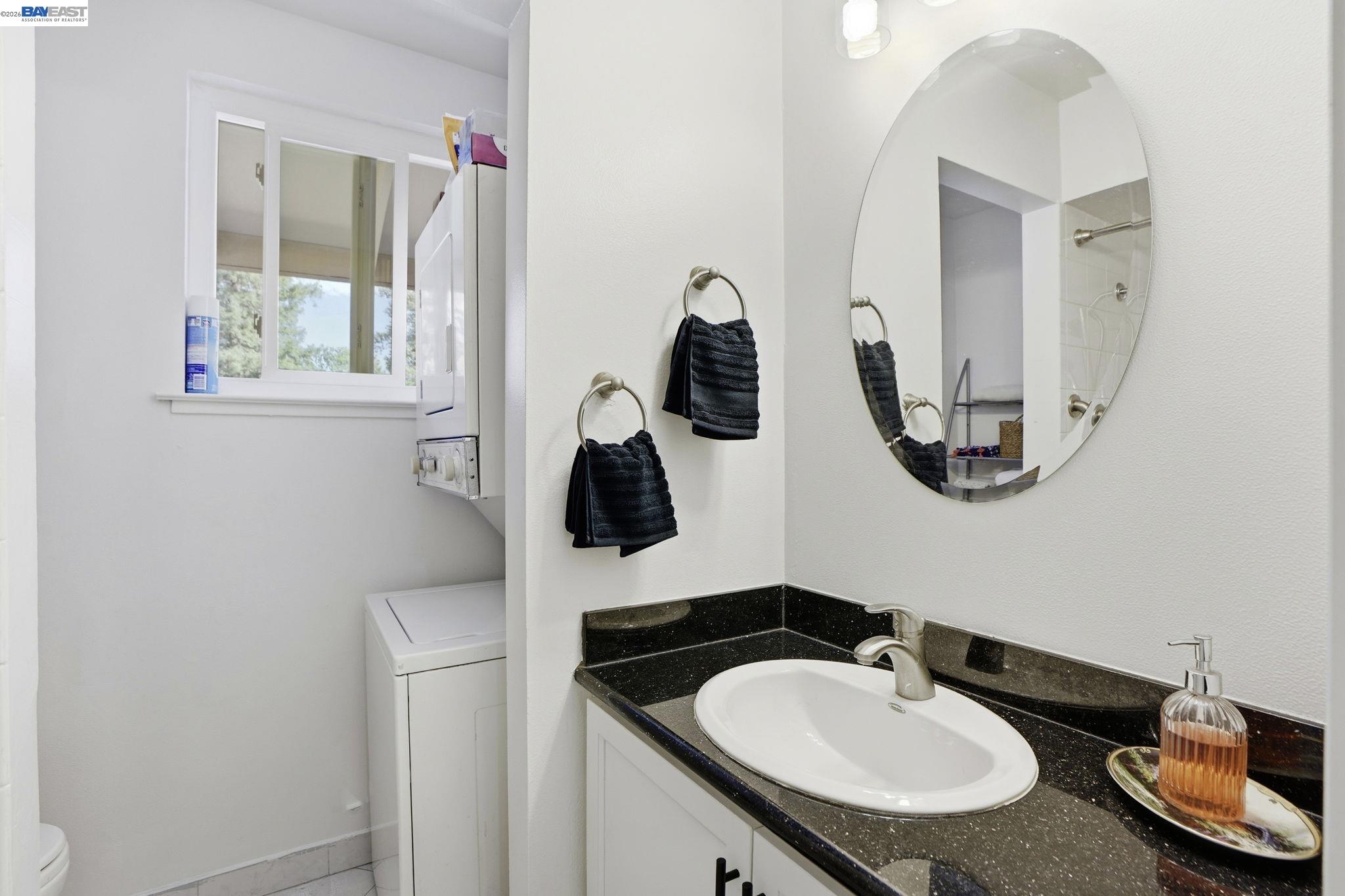 5505 Roundtree Drive, Unit B Concord, CA 94521 - Photo 19 of 29 a bathroom with a sink and a mirror