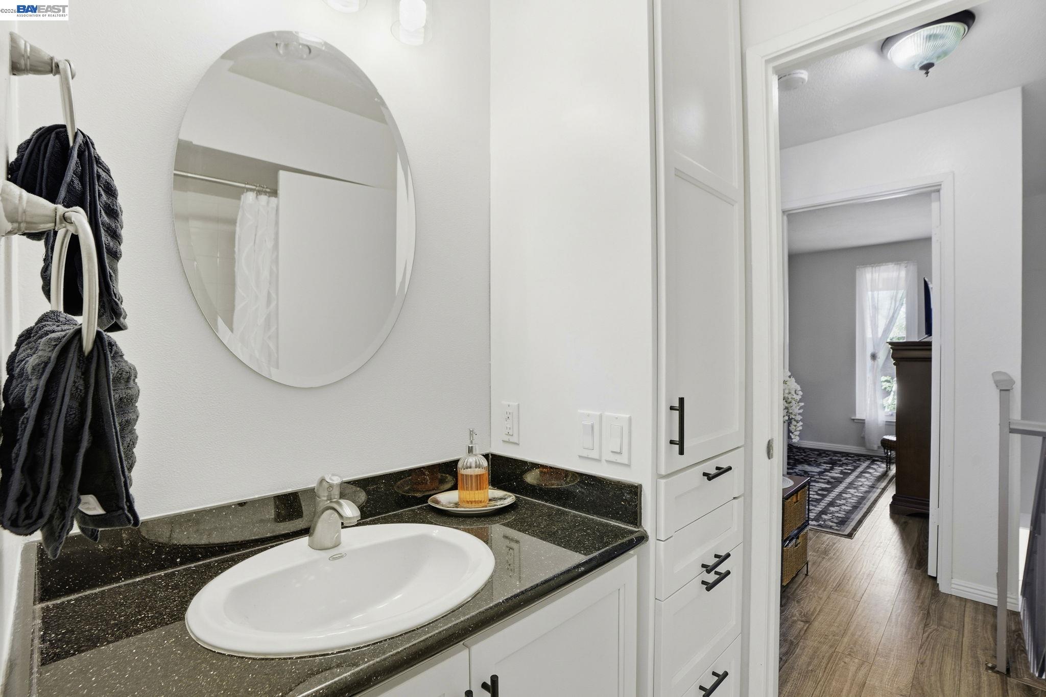 5505 Roundtree Drive, Unit B Concord, CA 94521 - Photo 20 of 29 a bathroom with a sink and a mirror