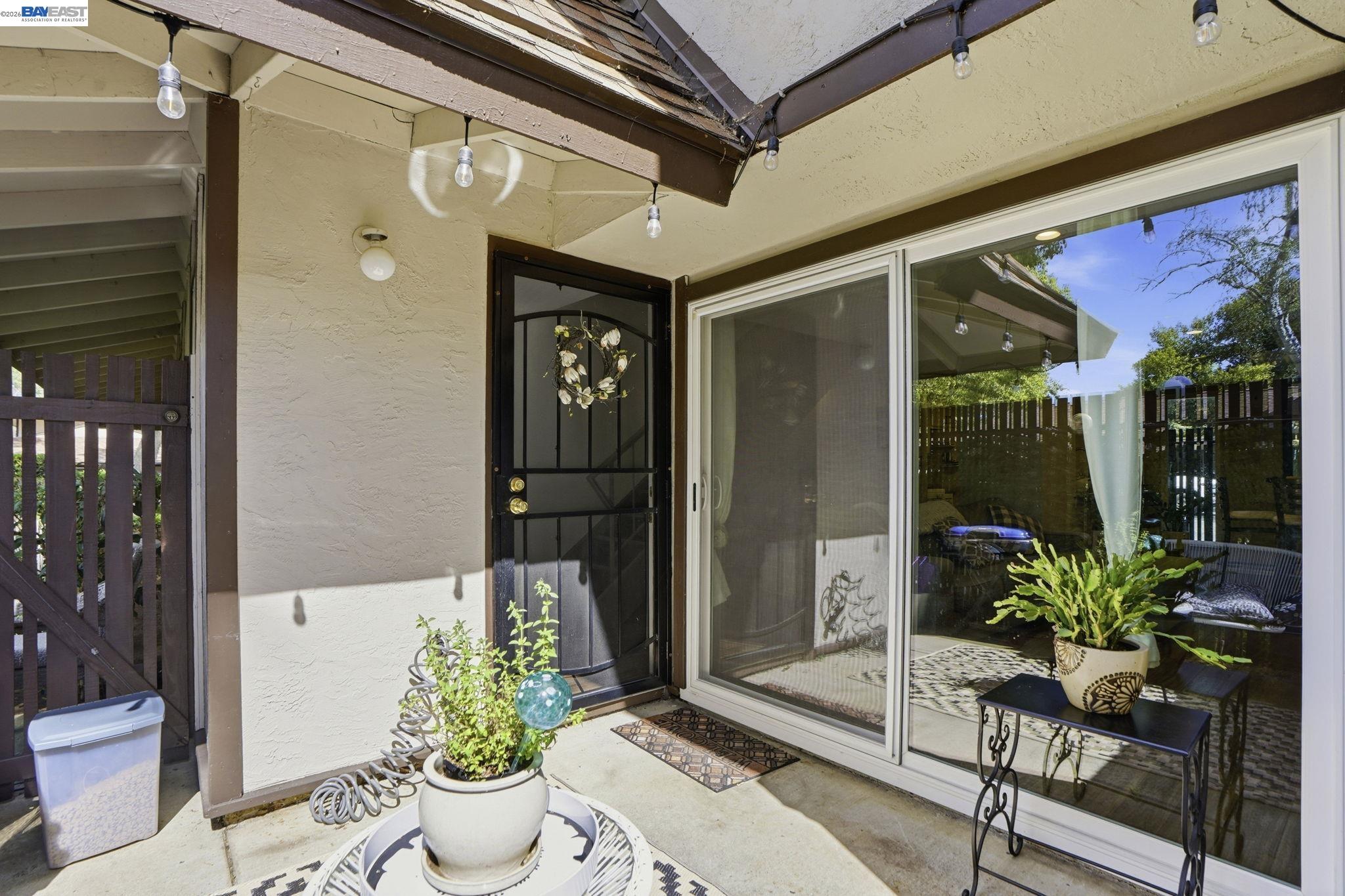 5505 Roundtree Drive, Unit B Concord, CA 94521 - Photo 23 of 29 a view of a porch with potted plants