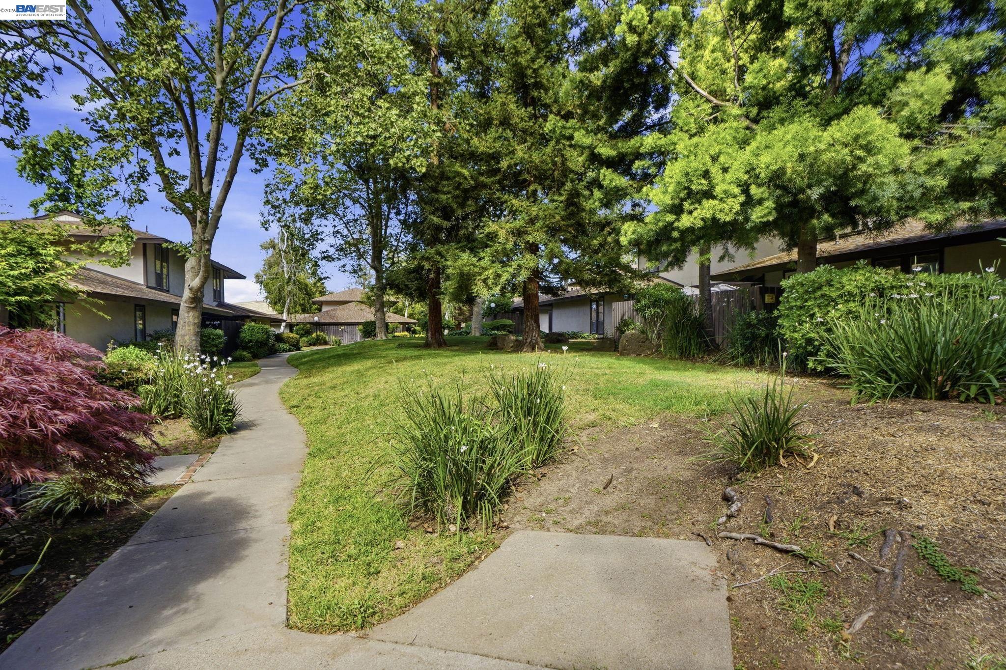 5505 Roundtree Drive, Unit B Concord, CA 94521 - Photo 26 of 29 a view of a garden with a fountain