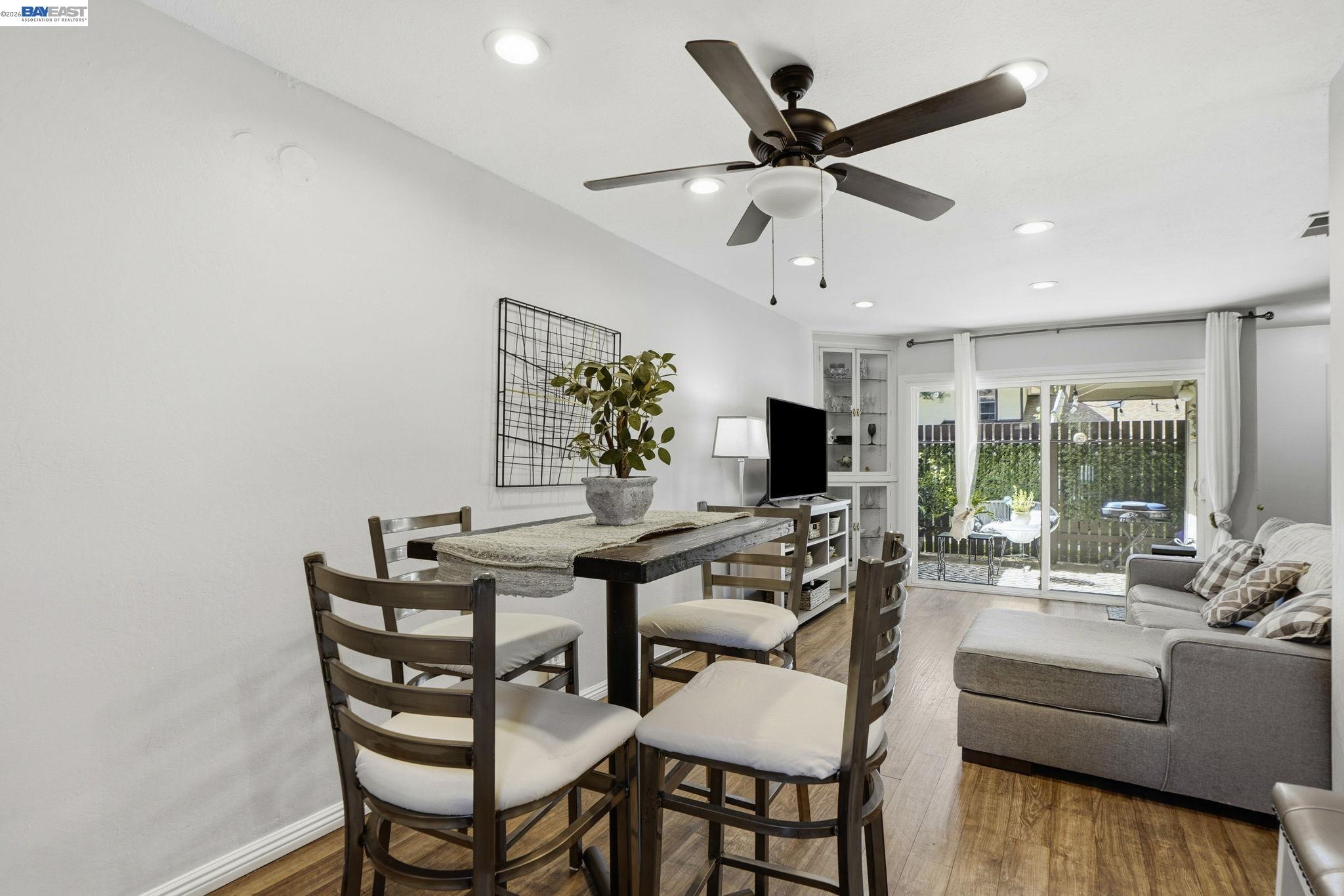 5505 Roundtree Drive, Unit B Concord, CA 94521 - Photo 3 of 29 a living room with furniture a ceiling fan and a large window