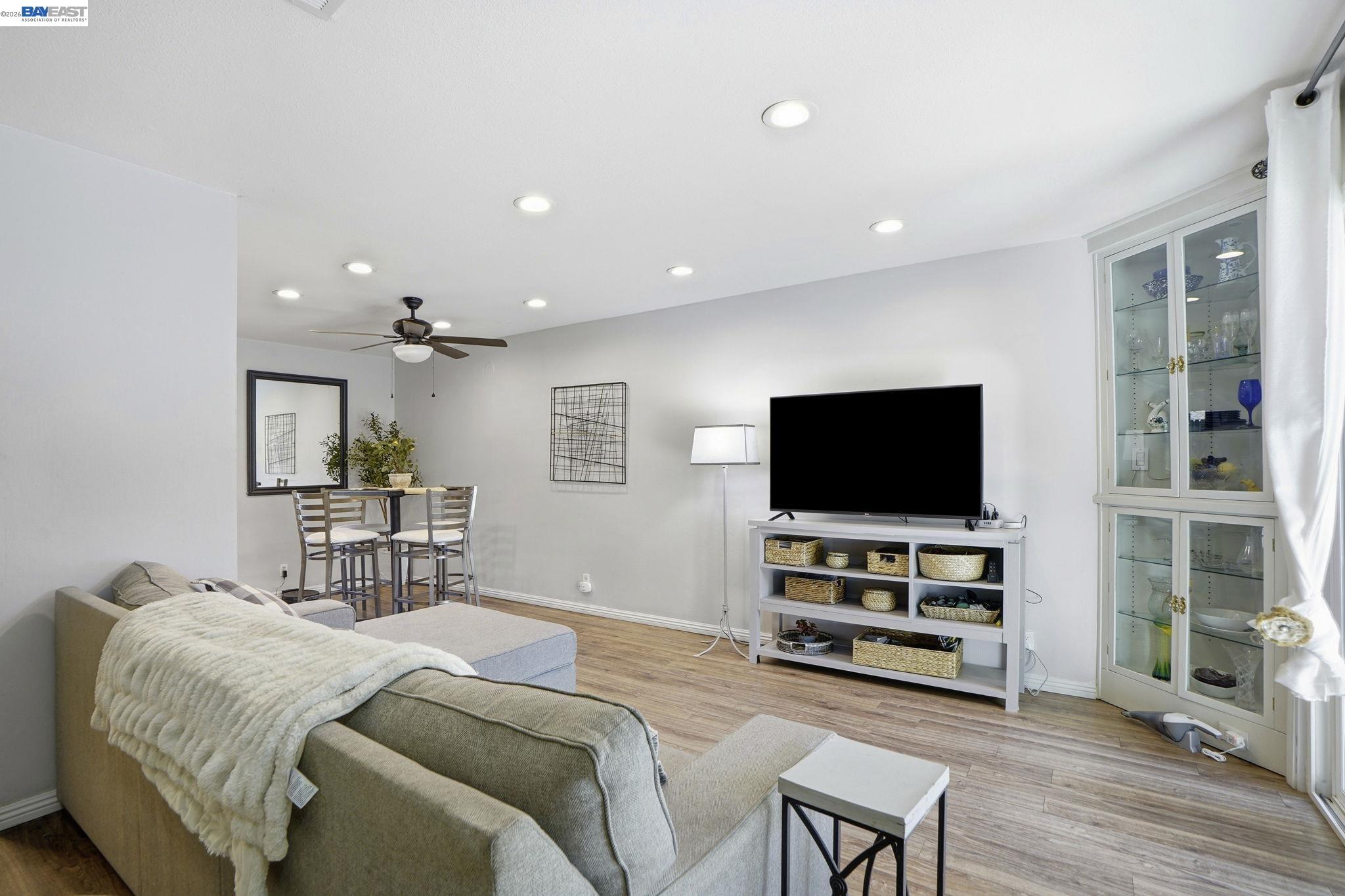 5505 Roundtree Drive, Unit B Concord, CA 94521 - Photo 7 of 29 a bedroom with furniture and a flat screen tv