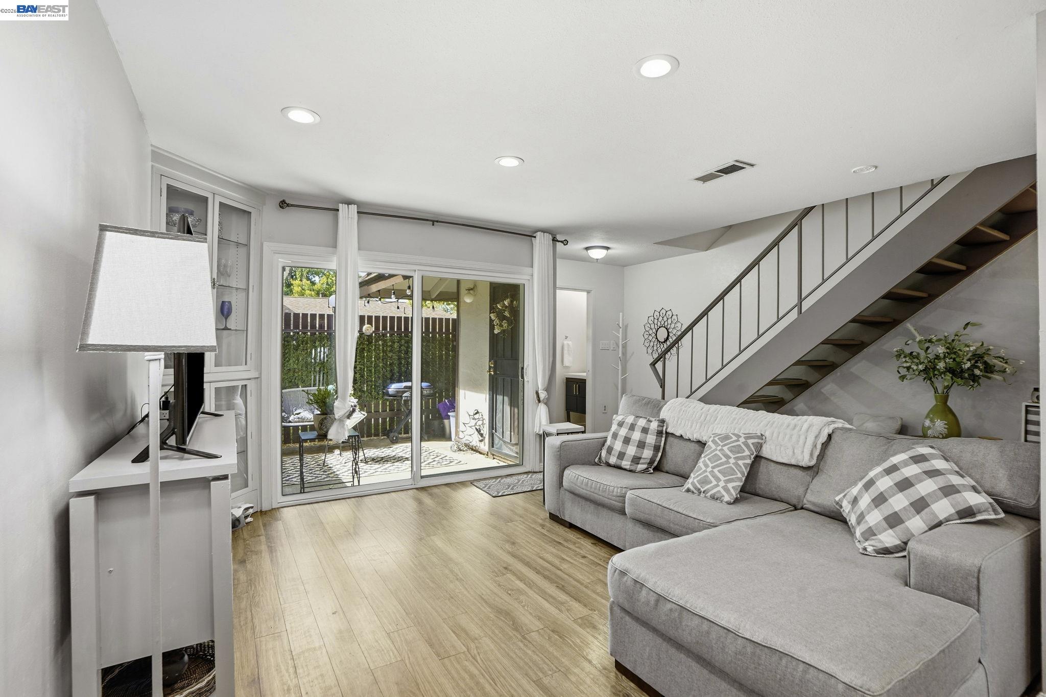 5505 Roundtree Drive, Unit B Concord, CA 94521 - Photo 8 of 29 a living room with furniture and wooden floor