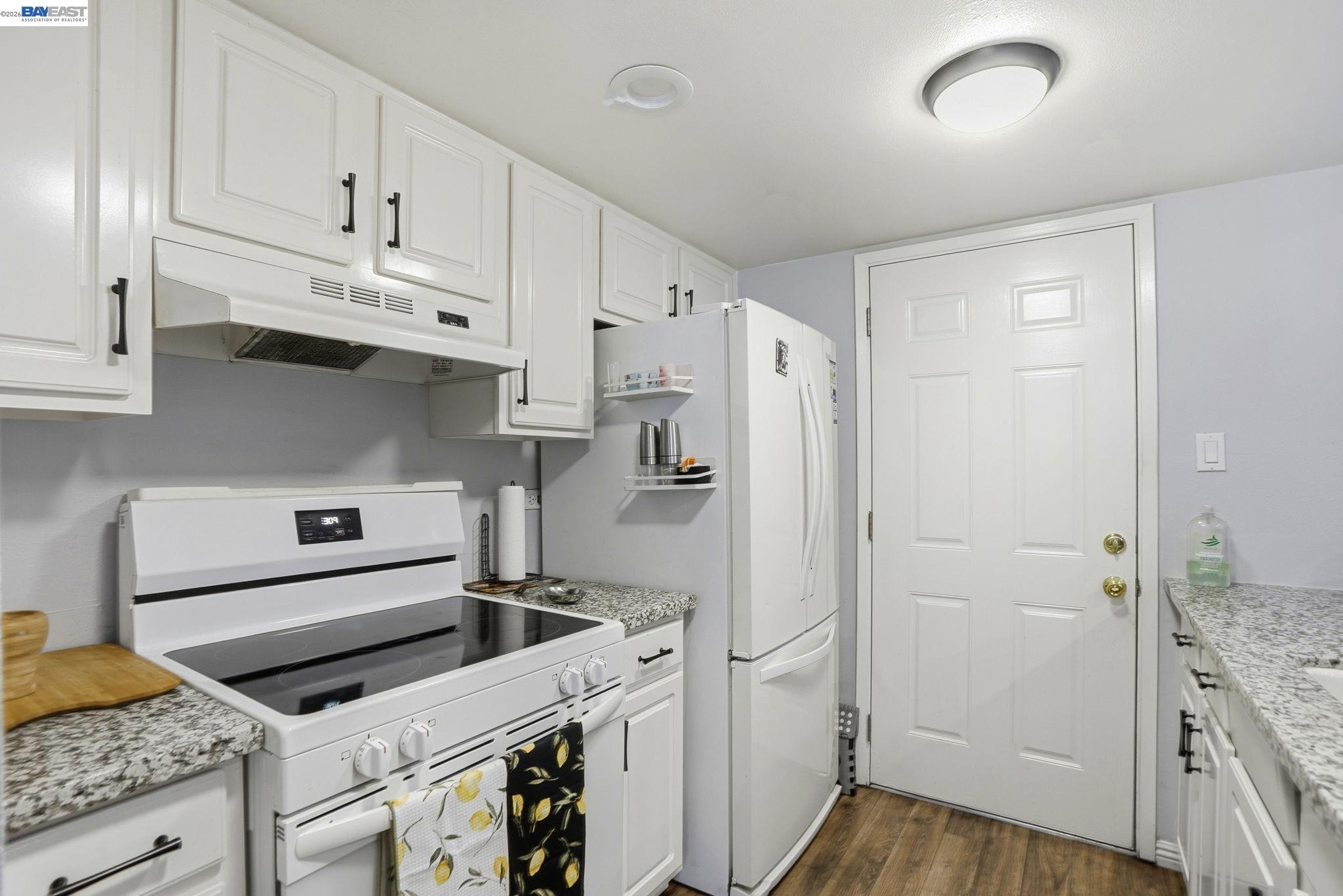 5505 Roundtree Drive, Unit B Concord, CA 94521 - Photo 9 of 29 a kitchen with cabinets and steel stainless steel appliances