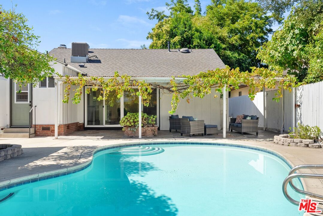 5752 Vesper Avenue Van Nuys, CA 91411 - Photo 19 of 30 a swimming pool with outdoor seating and yard