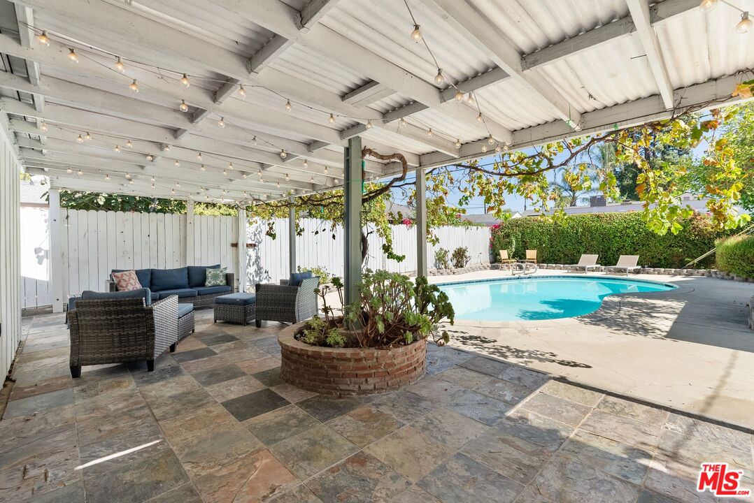 5752 Vesper Avenue Van Nuys, CA 91411 - Photo 20 of 30 a view of a patio with a table and chairs