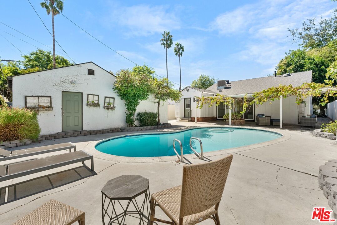 5752 Vesper Avenue Van Nuys, CA 91411 - Photo 22 of 30 a front view of a house with swimming pool