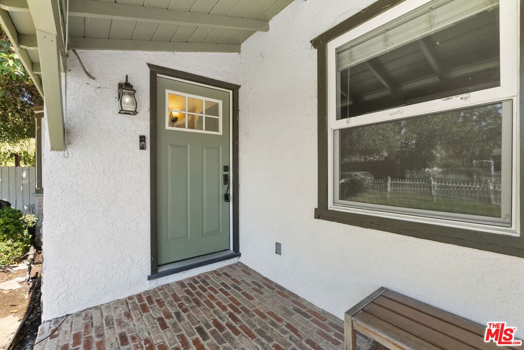 5752 Vesper Avenue Van Nuys, CA 91411 - Photo 26 of 30 a view of a hallway with a window