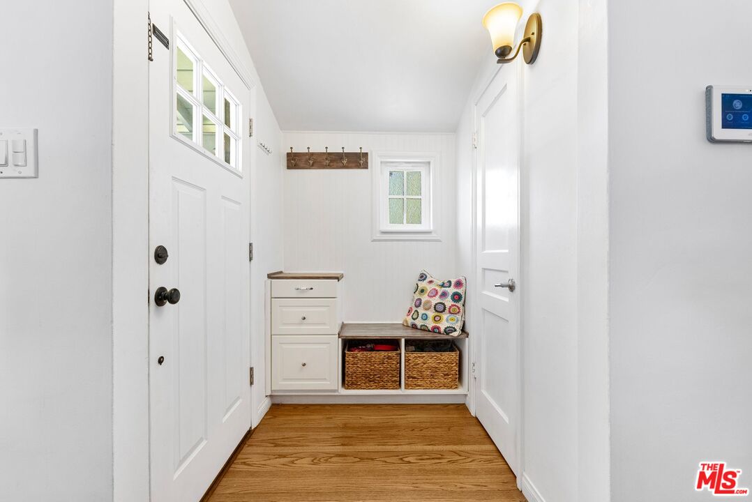 5752 Vesper Avenue Van Nuys, CA 91411 - Photo 27 of 30 a view of a hallway to a livingroom with furniture