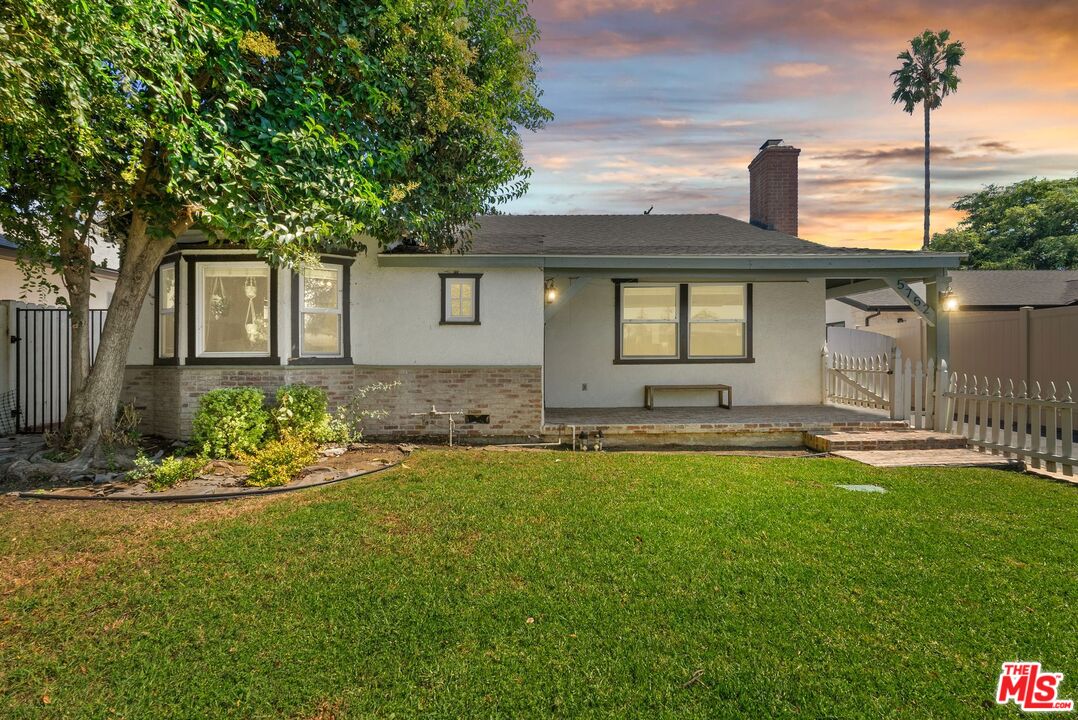 5752 Vesper Avenue Van Nuys, CA 91411 - Photo 30 of 30 a front view of a house with a garden and yard
