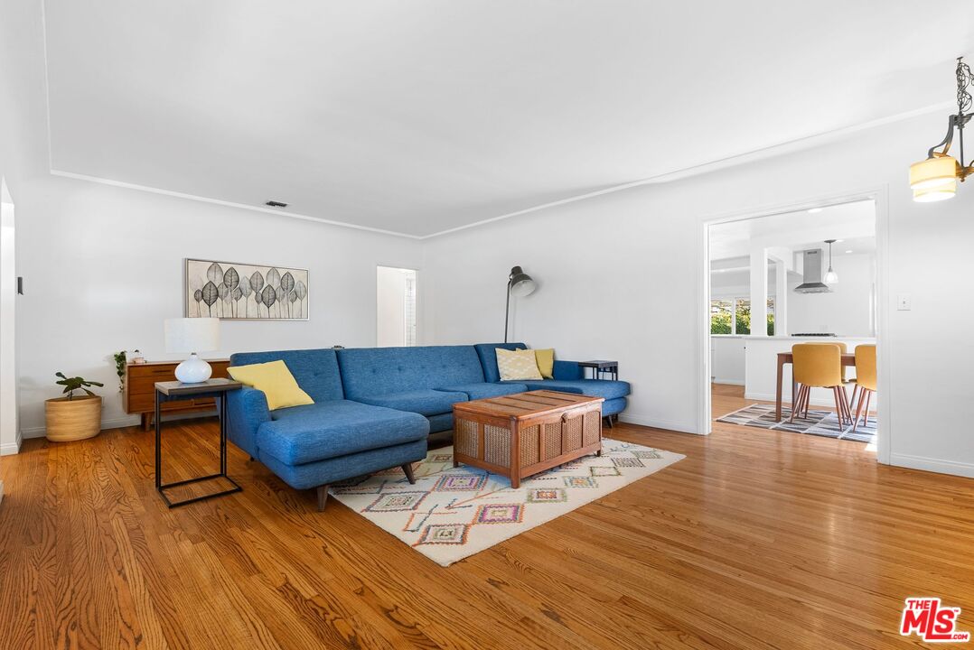 5752 Vesper Avenue Van Nuys, CA 91411 - Photo 5 of 30 a living room with furniture and wooden floor