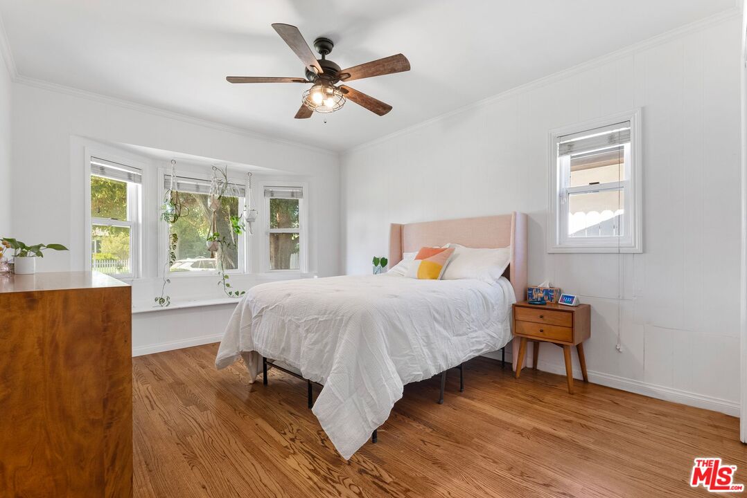 5752 Vesper Avenue Van Nuys, CA 91411 - Photo 8 of 30 a bed sitting in a bedroom next to a window