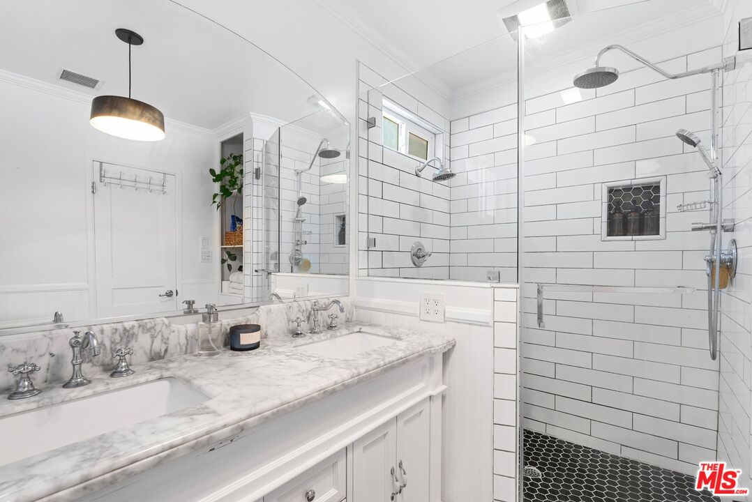 5752 Vesper Avenue Van Nuys, CA 91411 - Photo 9 of 30 a bathroom with a sink and a mirror