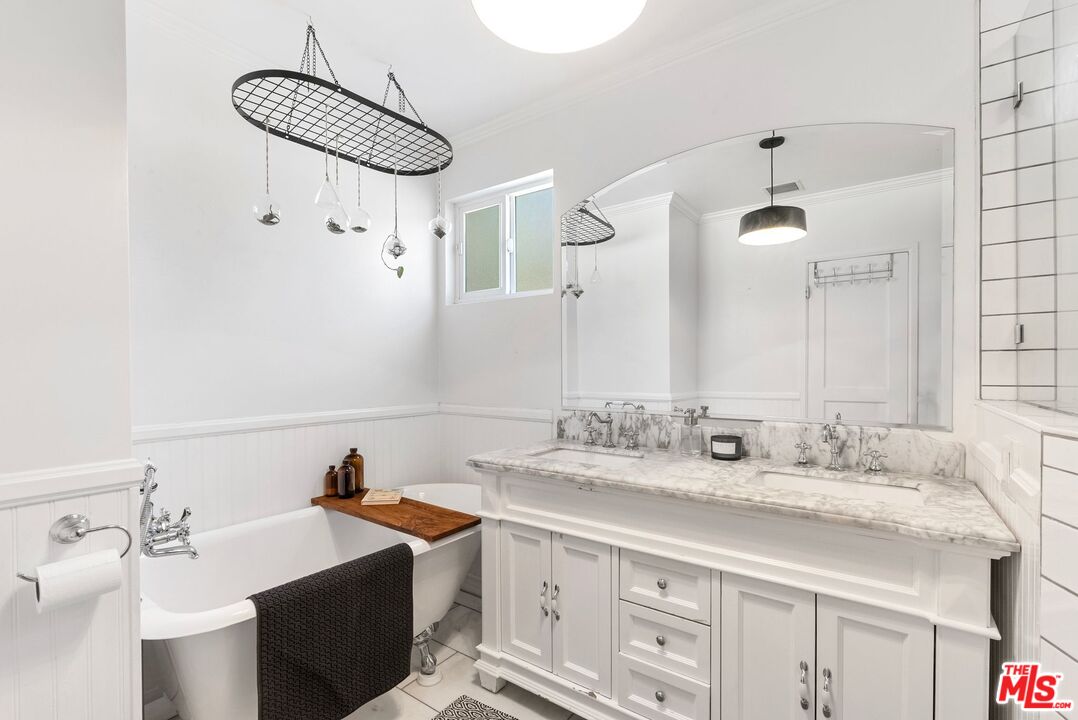 5752 Vesper Avenue Van Nuys, CA 91411 - Photo 10 of 30 a bathroom with a sink and a mirror
