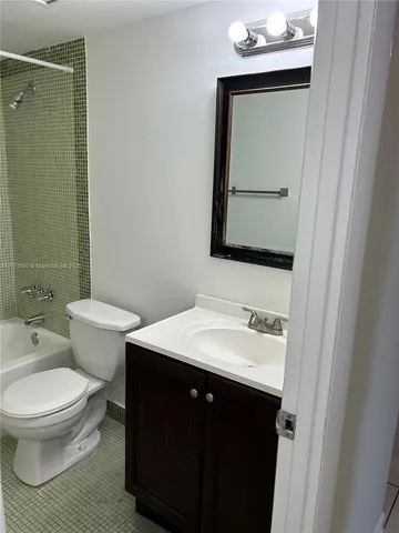 a couple of palm trees sitting in front of a house