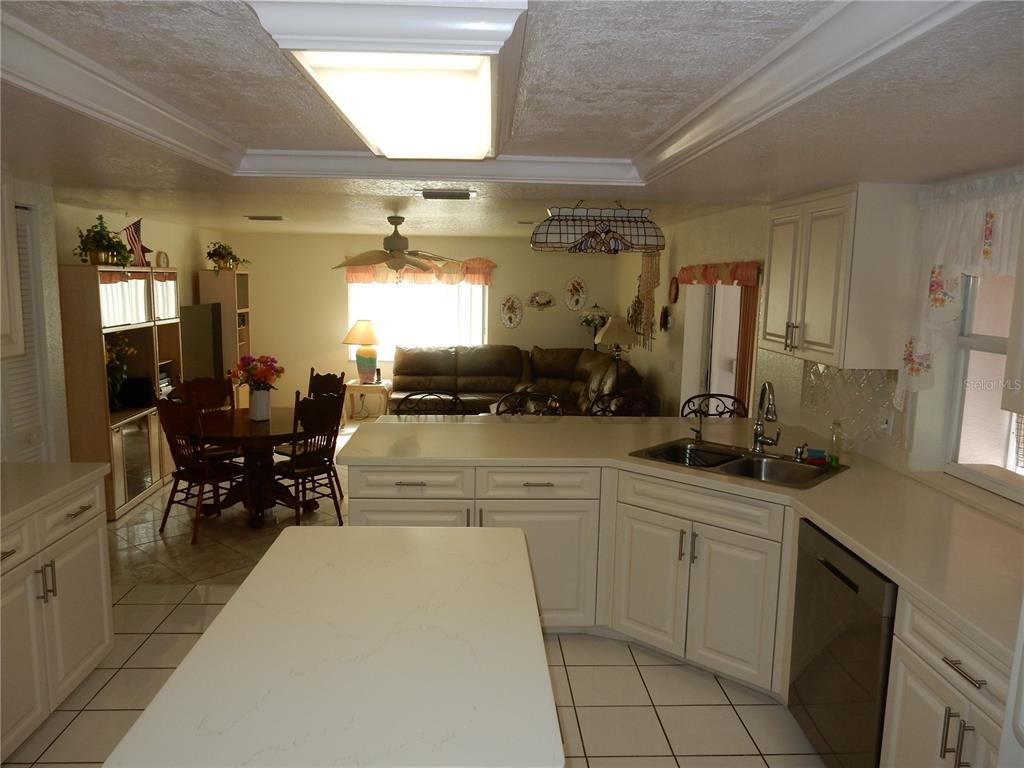 7321 Powder Puff Punta Gorda, FL 33955 - Photo 11 of 31 Kitchen to Family Room