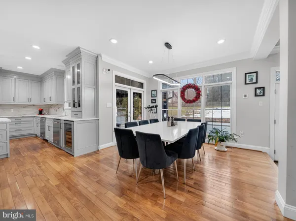 a kitchen with granite countertop stainless steel appliances a sink stove and cabinets