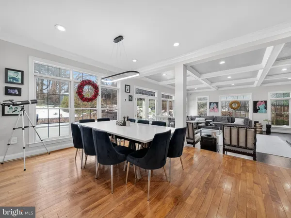 a kitchen with granite countertop stainless steel appliances a sink stove top oven and cabinets