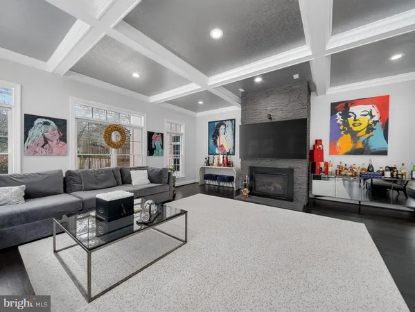 a bedroom with furniture and a flat screen tv