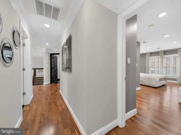 a bathroom with a sink a toilet a mirror and shower