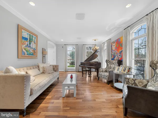 a view of a dining room with furniture wooden floor and chandelier