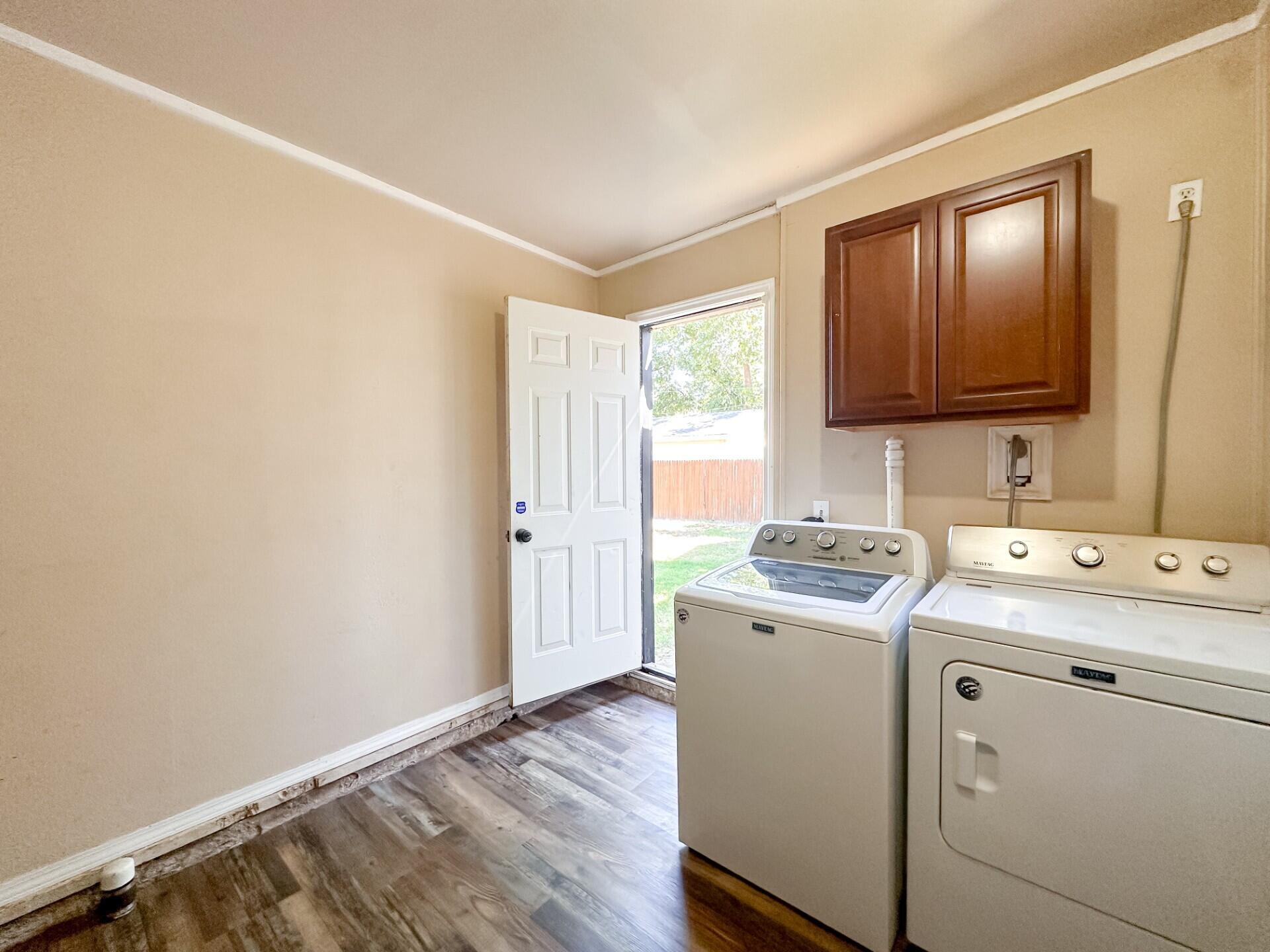 3714 26th Street Lubbock, TX 79410 - Photo 16 of 18 a view of utility room with washer and dryer