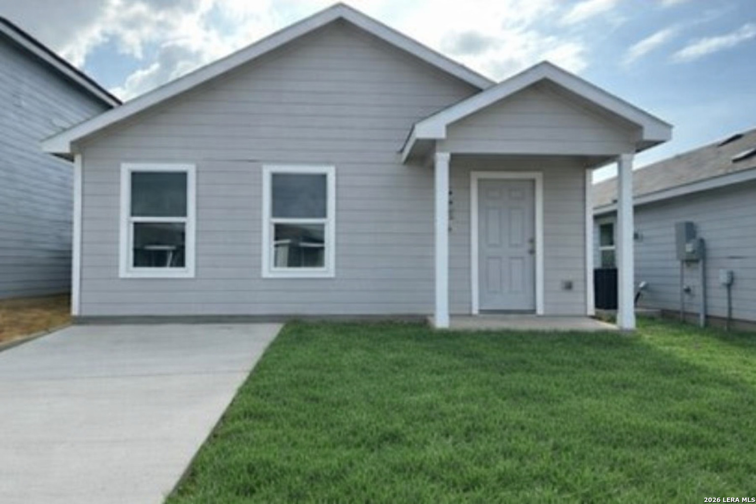 6926 Biotite Ridge Elmendorf, TX 78112 - Photo 1 of 1 a view of a house with a yard