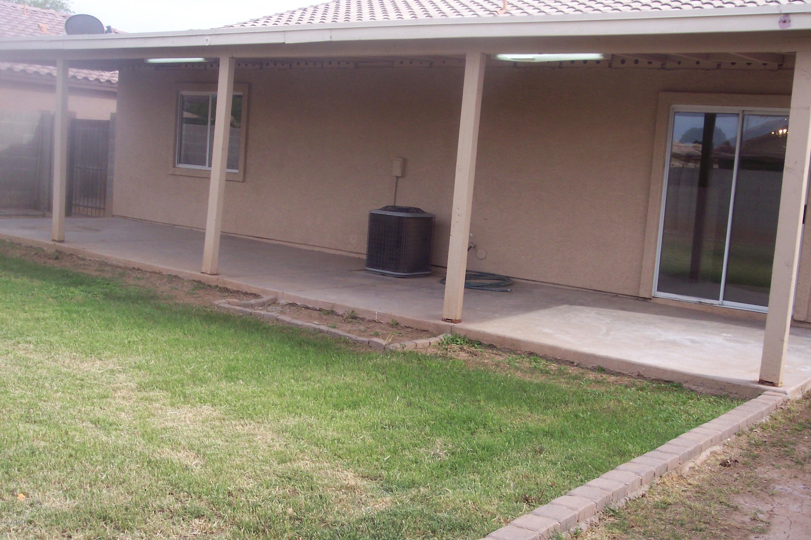 7120 West Zak Road Phoenix, AZ 85043 - Photo 2 of 10 a backyard of a house with lots of green space