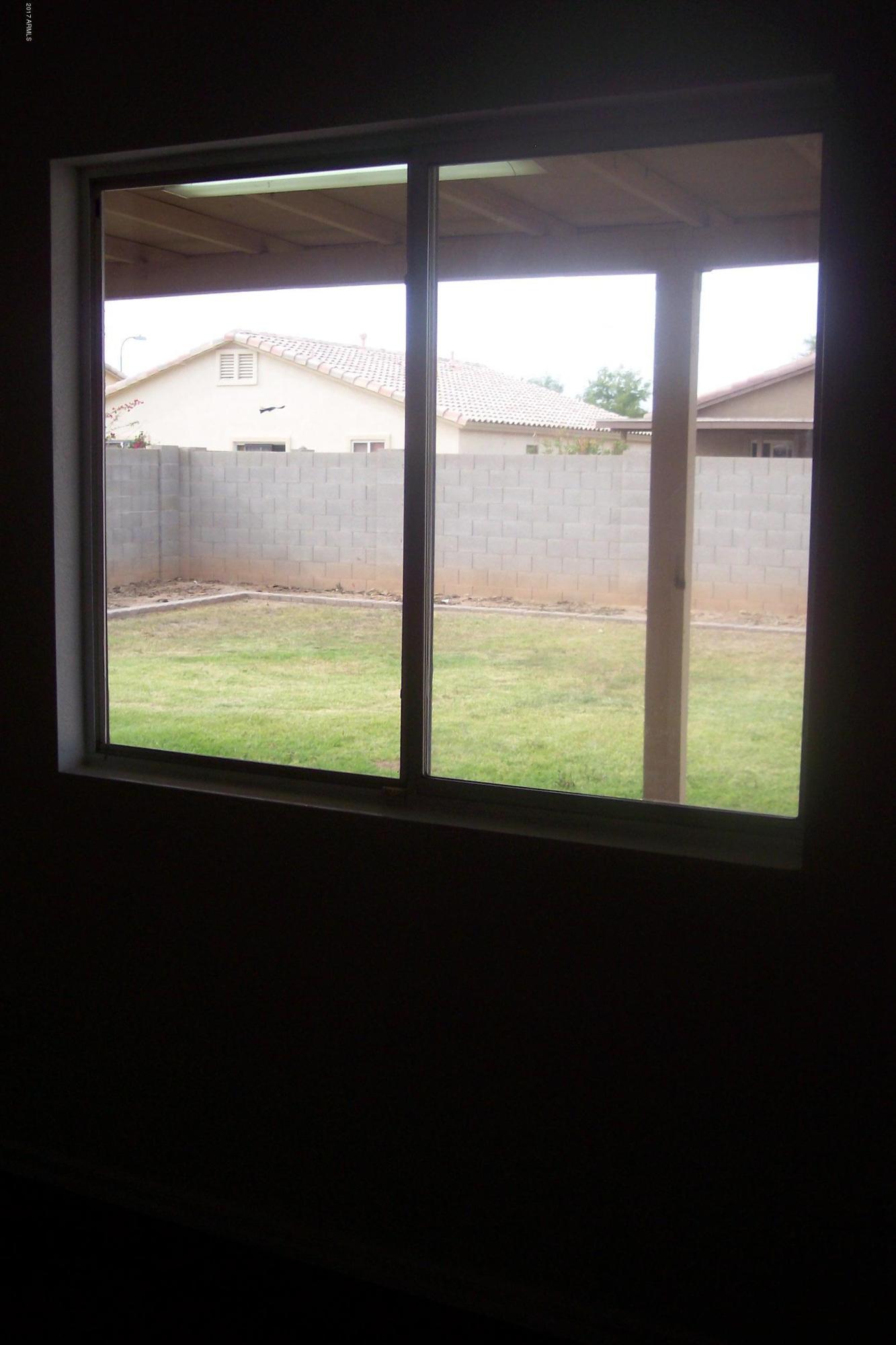 7120 West Zak Road Phoenix, AZ 85043 - Photo 7 of 10 a view of an empty room with a window