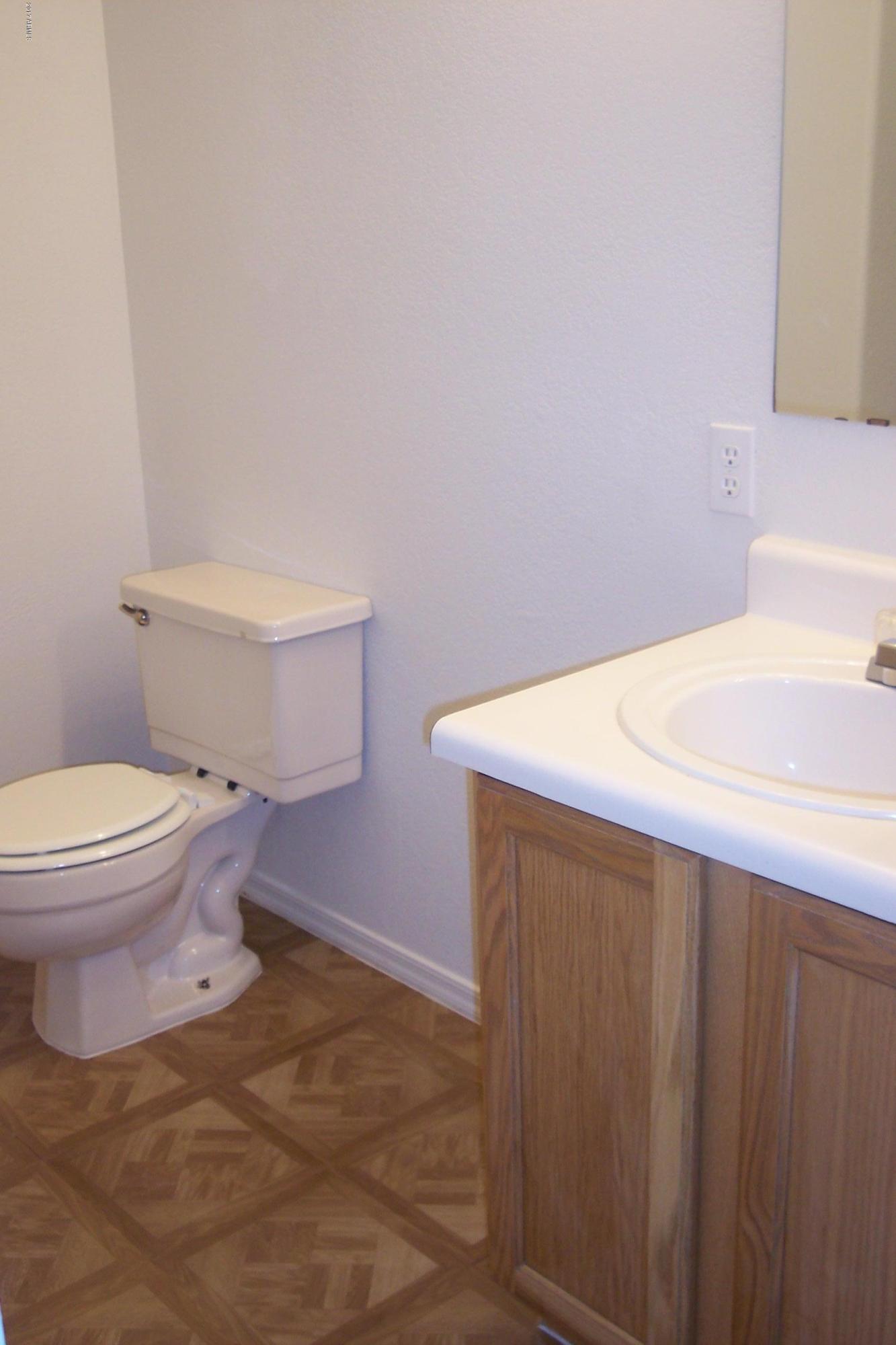 7120 West Zak Road Phoenix, AZ 85043 - Photo 9 of 10 a bathroom with a sink and a toilet