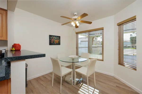 a dining room with furniture and window